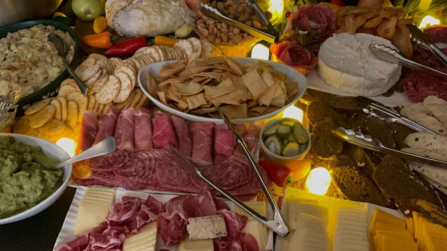 Charcuterie boards with cured meats, cheeses and green chile dips