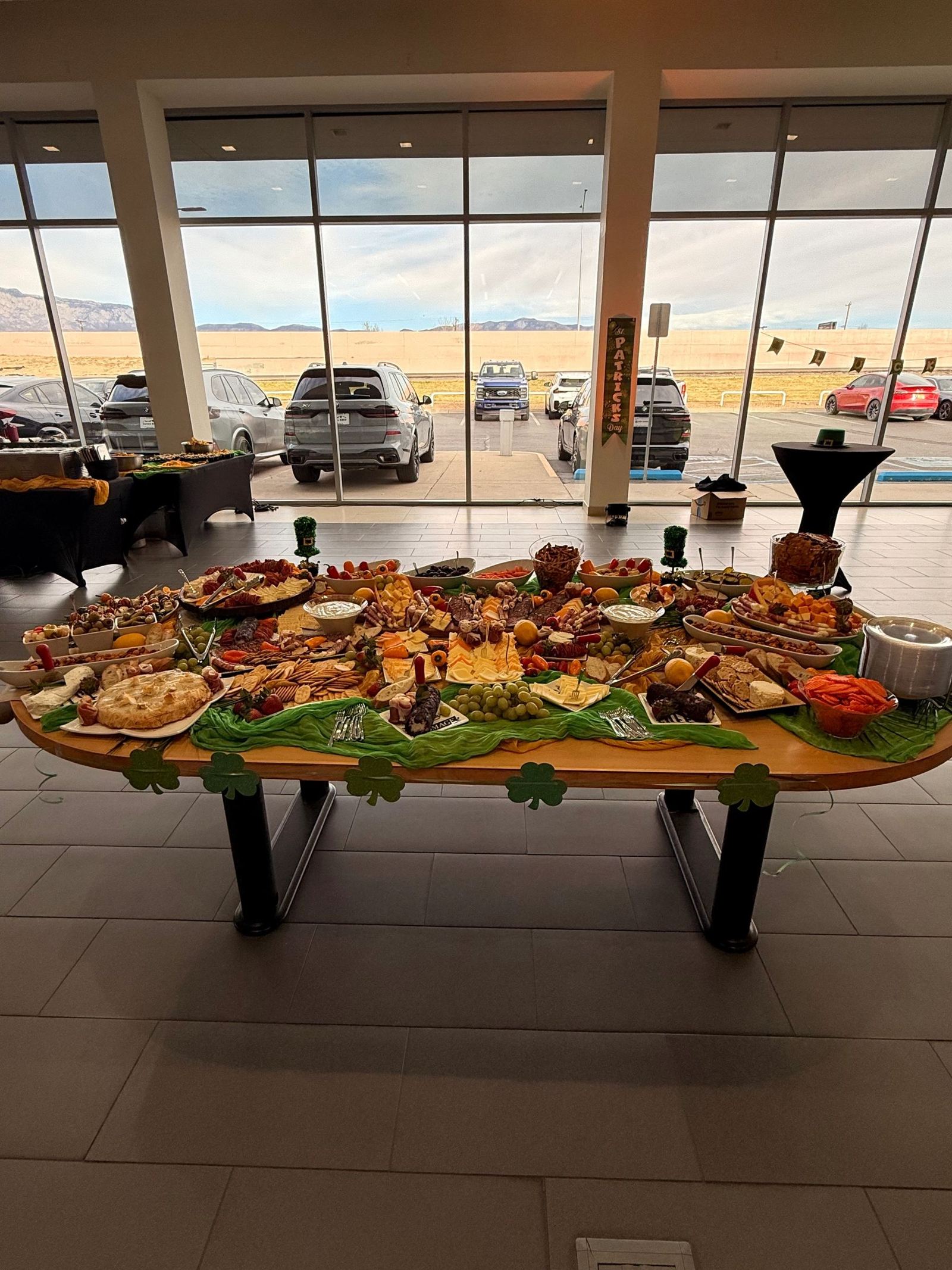 Giant grazing table with charcuterie, cheeses, fruit and dips at a corporate event