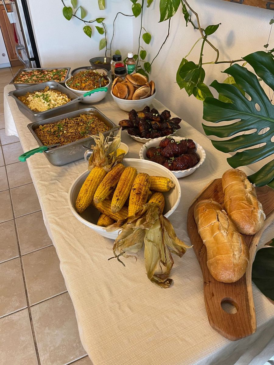 Buffet spread with charred street corn and bolillo rolls