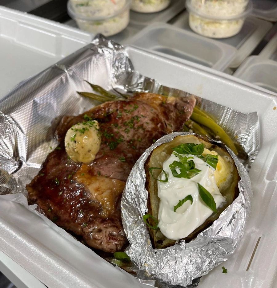 Steak and loaded baked potato to-go plate