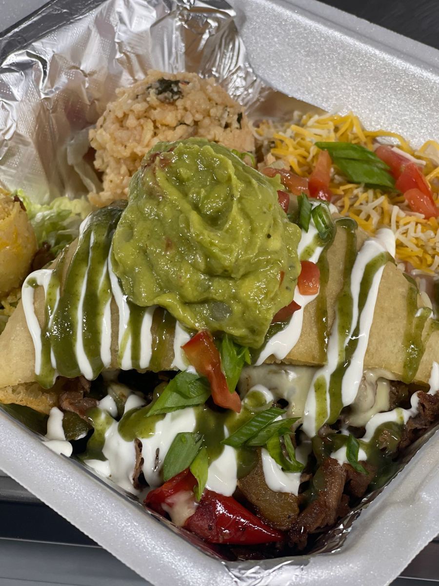 Stuffed sopapilla plate topped with fresh guacamole
