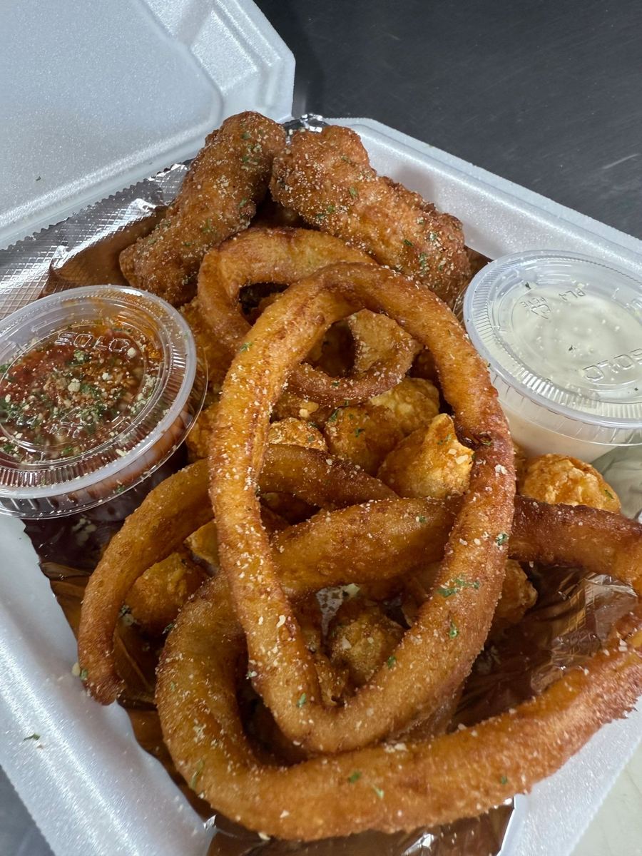 Hand-breaded onion rings with dipping sauces