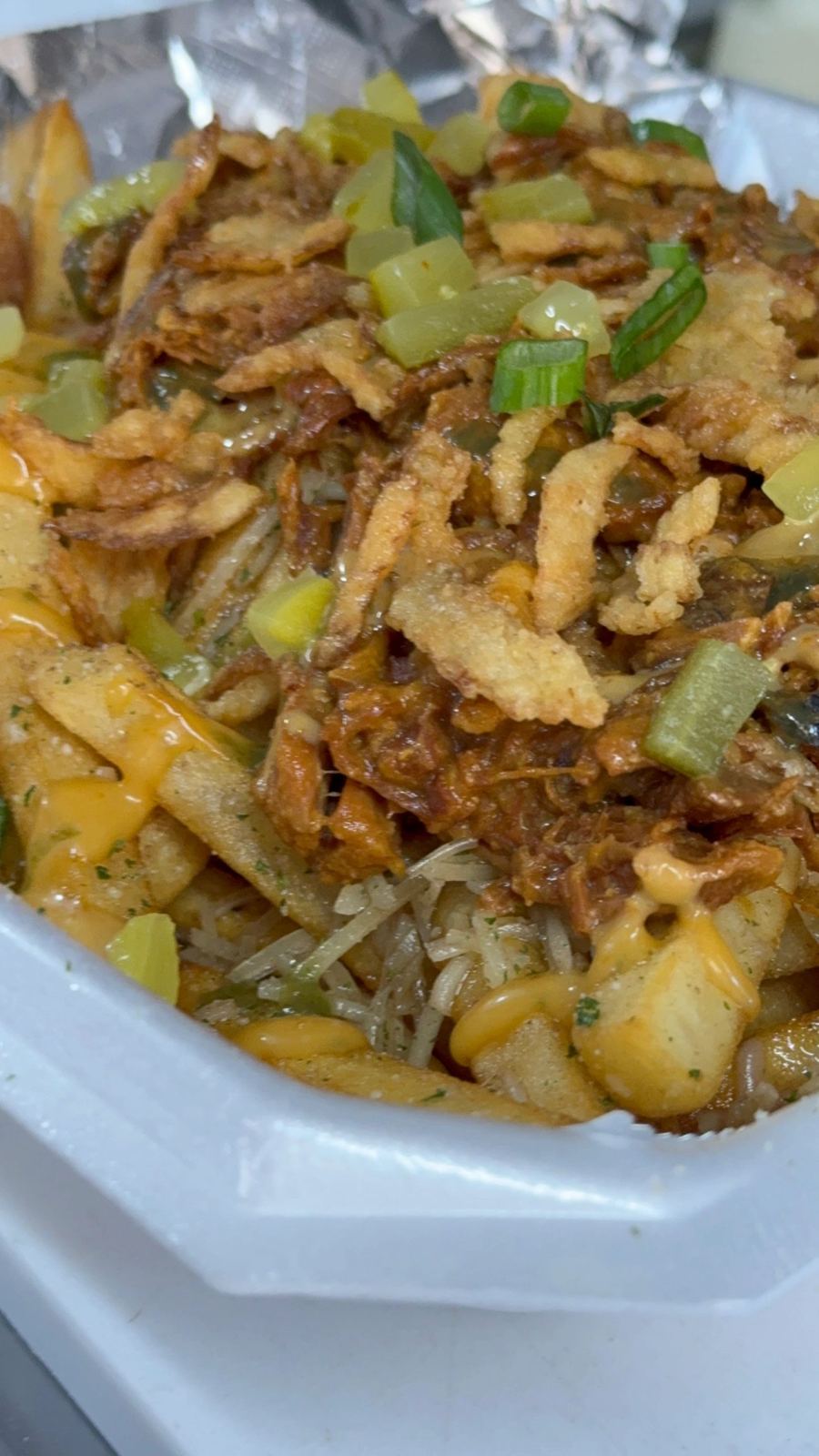 Green chile stew loaded with crispy onions
