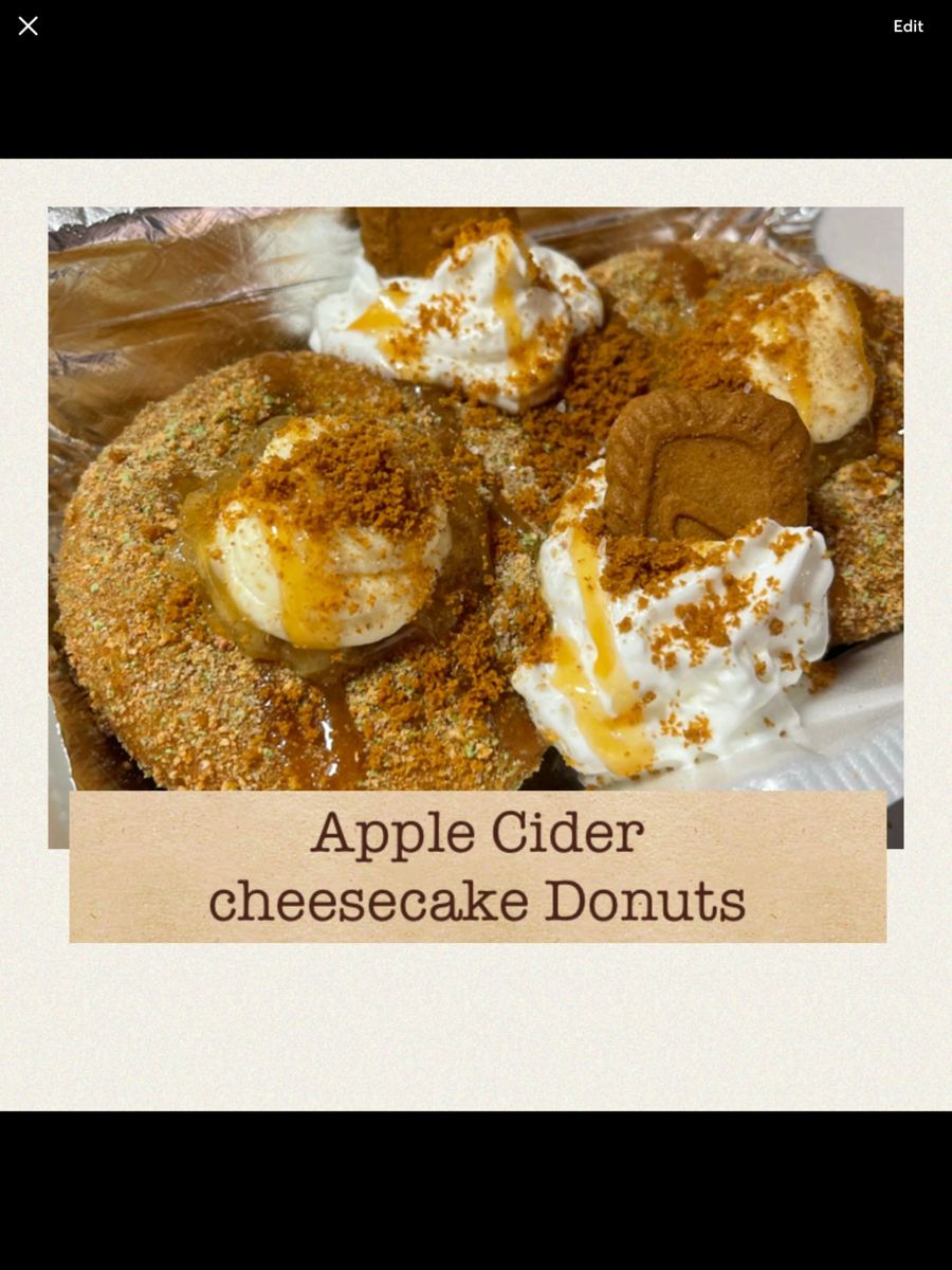 Apple cider cheesecake donuts with whipped topping and cookie crumble